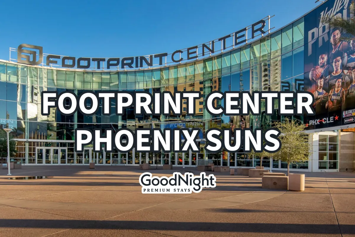 The prominent FOOTPRINT CENTER sign stands above a wide glass facade, with Phoenix Suns branding visible. The paved entrance area is busy and open, signaling a vibrant downtown scene ideal for social outings, including visits to pet-friendly patios and community events.
